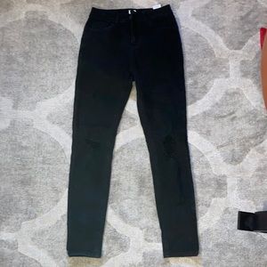 Mid-rise skinny black jeans. They are a size 5 and barely worn!